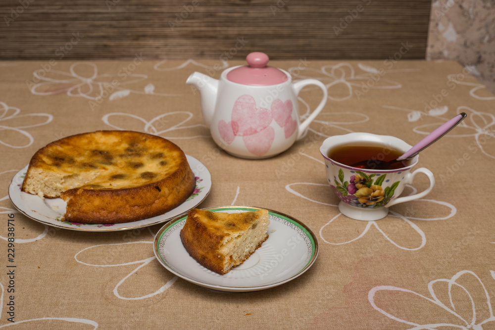 Still life with tea cup, piece of pie, plate, teapot Still life with tea cup, piece of pie, plate, teapot