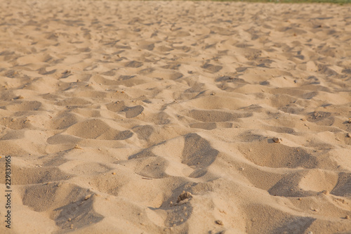 Closeup of sand pattern of a beach in the summer. Background.concept for summer season