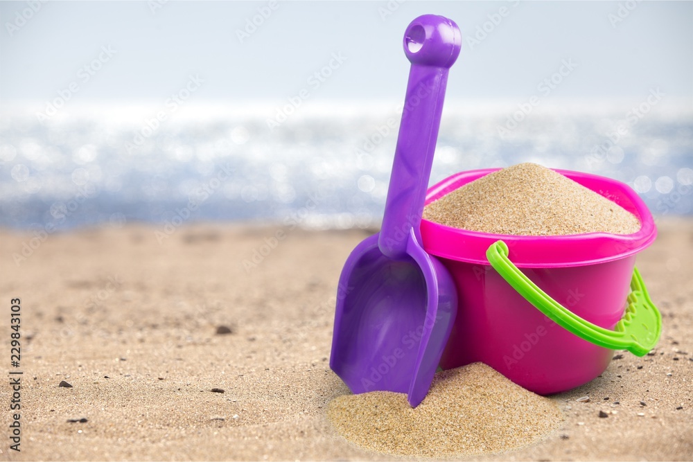 Shot of the beach on a sunny day, with a spade and bucket Shot of the beach on a sunny day, with a spade and bucket