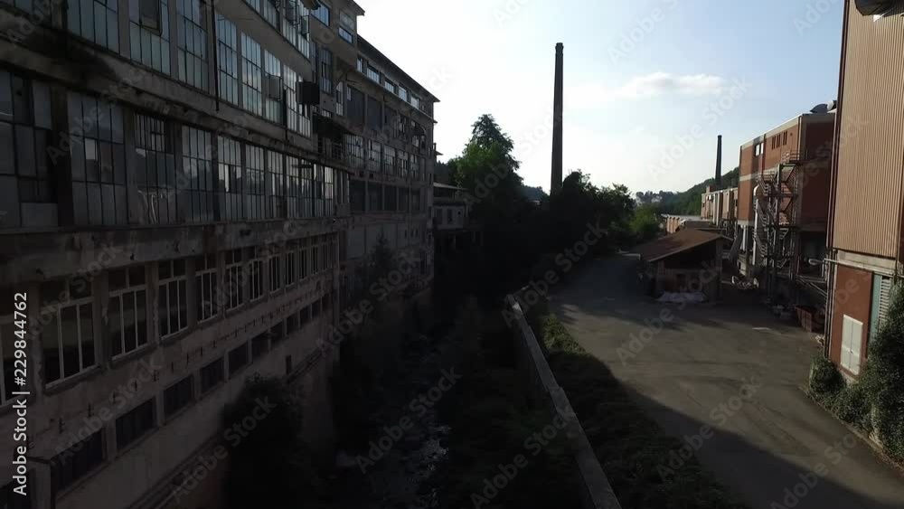 an exciting flight between old abandoned factories at sunset and dawn.
Backwards aerial shots with the drone.Blue sky. an exciting flight between old abandoned factories at sunset and dawn.
Backwards aerial shots with the drone.Blue sky.