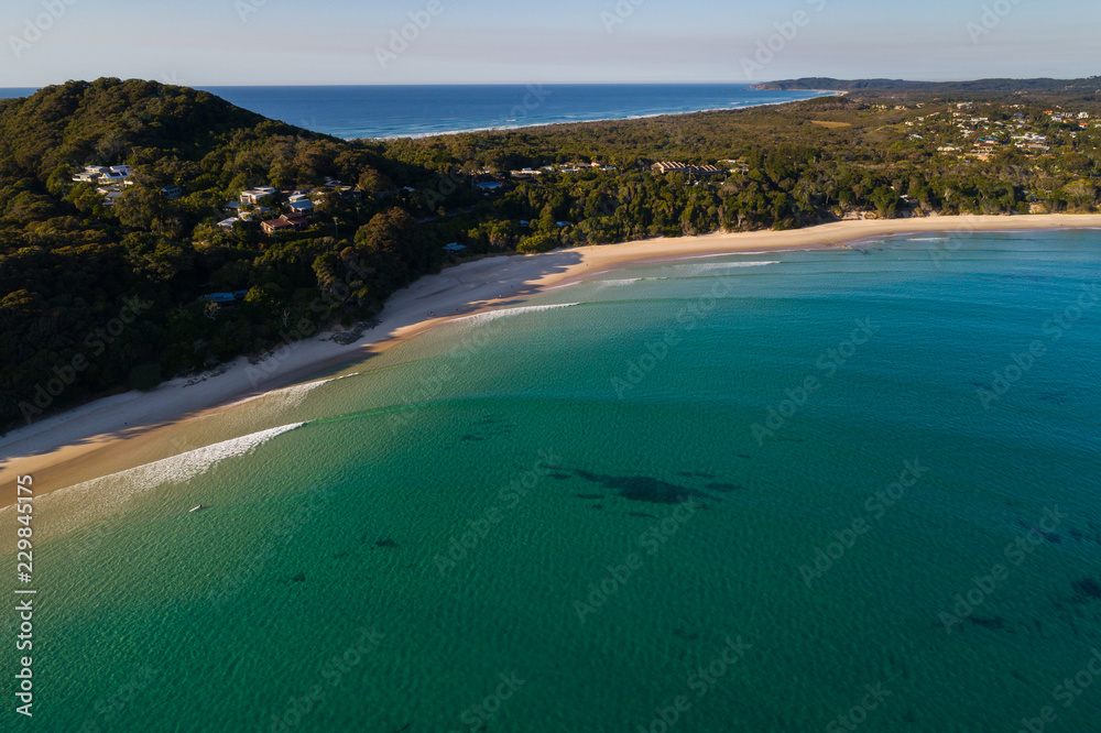 Byron Bay, New South Wales/Australia - 14 August 2018: Aerial drone image over the beach and water at Byron Bay. Byron Bay, New South Wales/Australia - 14 August 2018: Aerial drone image over the beach and water at Byron Bay.