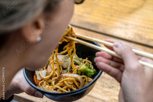 Traditional chinese food noodle served in a bowl photo