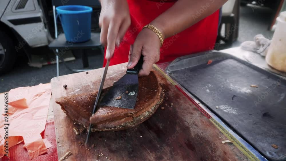 Seller wrapping up Apam Balik traditional pancake of Malaysia Seller wrapping up Apam Balik traditional pancake of Malaysia