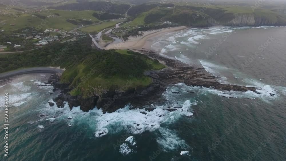 Cinematic aerial flying over coast of East London South Africa at sunrise Cinematic aerial flying over coast of East London South Africa at sunrise