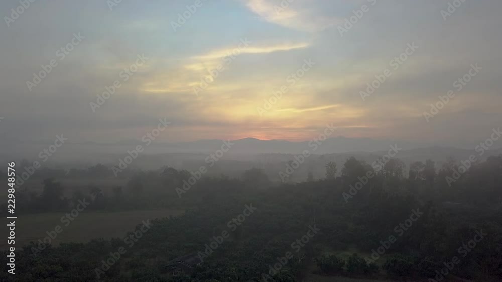 Raising up looking over farming fields at the most beautiful morning sunrise in Chiang Rai Thailand Raising up looking over farming fields at the most beautiful morning sunrise in Chiang Rai Thailand