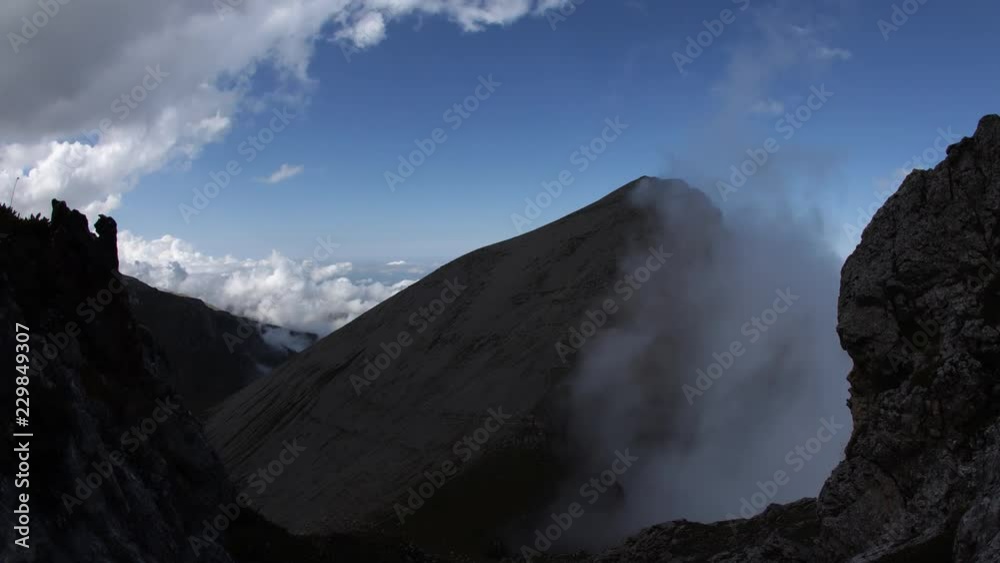 Time lapse of clouds over mountain tops. Time lapse of clouds over mountain tops.