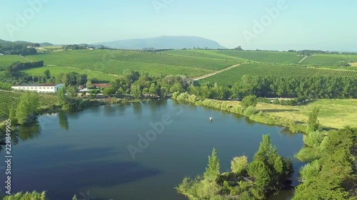 A small reservoir in the middle of crops and farms. photo