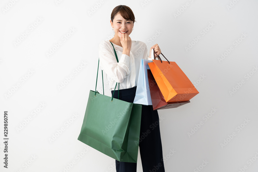 young asian woman shopping image on whtie background young asian woman shopping image on whtie background