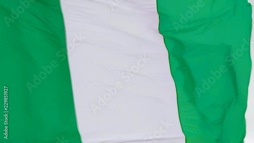 Nigerian Flag fluttering in the wind in slow motion photo