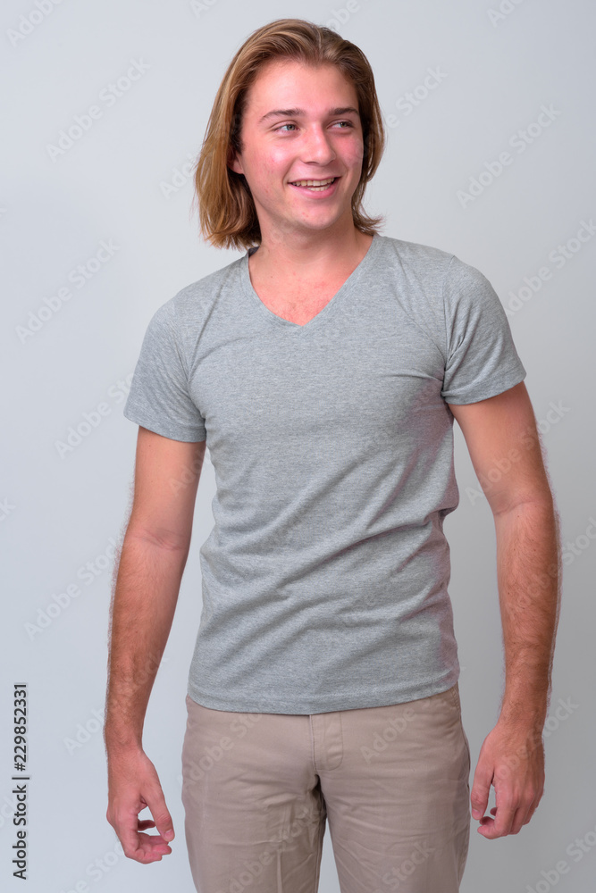 Obraz premium Young handsome man with long blond hair