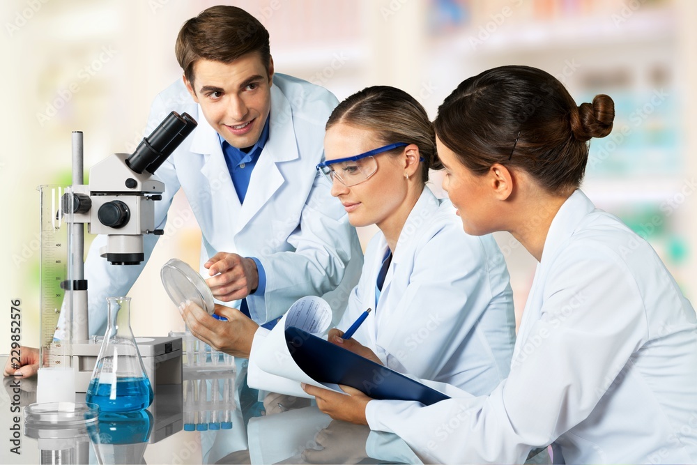 Man researcher carrying out scientific research lab Man researcher carrying out scientific research lab