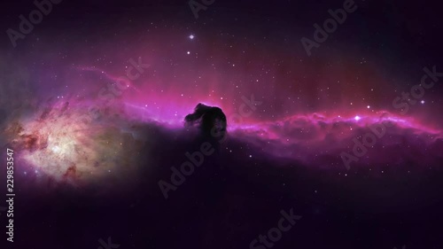 4K Zooming into the horsehead Nebula south of the star Alnitak in space. photo