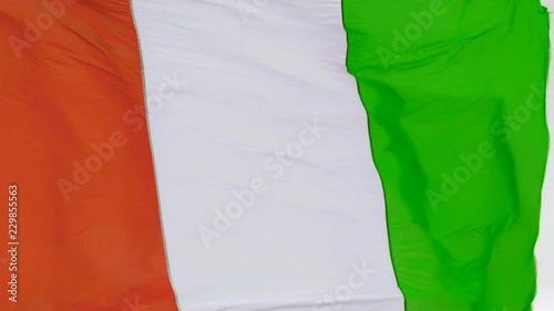 Slow motion footage of the Flag of Ivory Coast waving in the wind photo