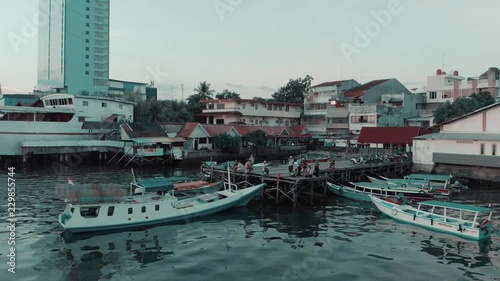 Aerial Pan Shoot view of several Traditional Wooden Boats on Indonesian Traditional Port photo