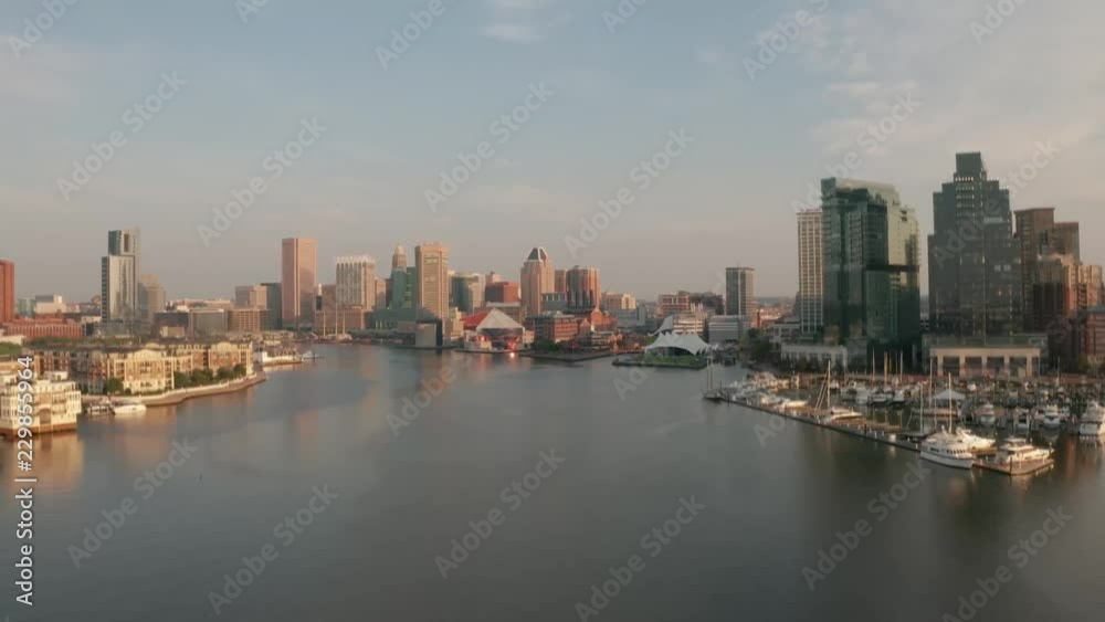 Baltimore Inner Harbor Cinematic Water Aerial during sunrise. Shot in 4K in H-log for complete color correction capability. Shot on Mavic 2 Pro. Baltimore Inner Harbor Cinematic Water Aerial during sunrise. Shot in 4K in H-log for complete color correction capability. Shot on Mavic 2 Pro.