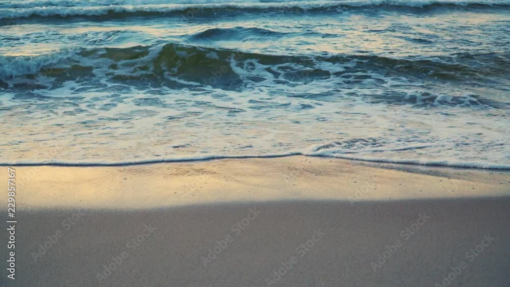 foamy sea waves during sunset in summer foamy sea waves during sunset in summer