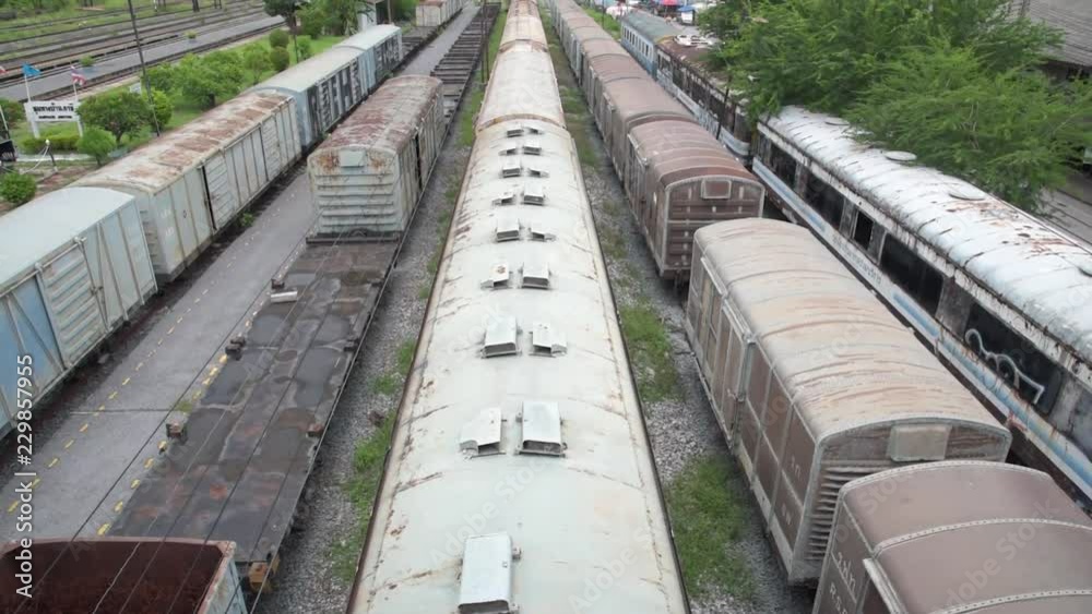 Old rusty abandoned train sitting in the graveyard. TILT UP. Old rusty abandoned train sitting in the graveyard. TILT UP.