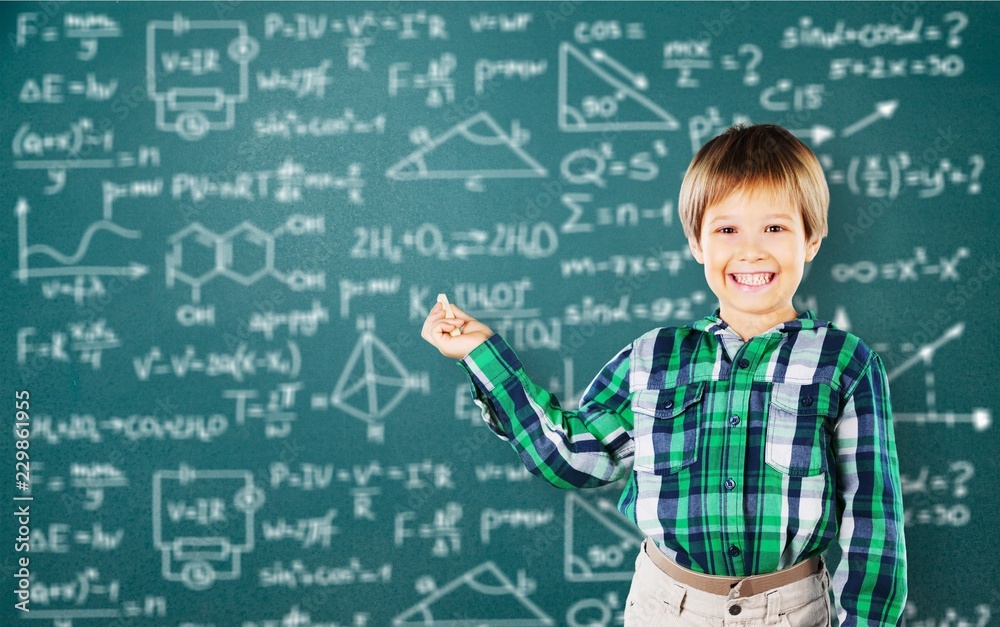 Cute little schoolgirl in glasses on blackboard Cute little schoolgirl in glasses on blackboard