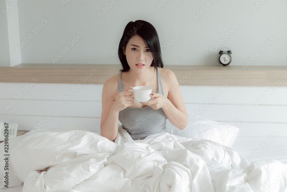 thai model drinking morning coffee in bedroom thai model drinking morning coffee in bedroom