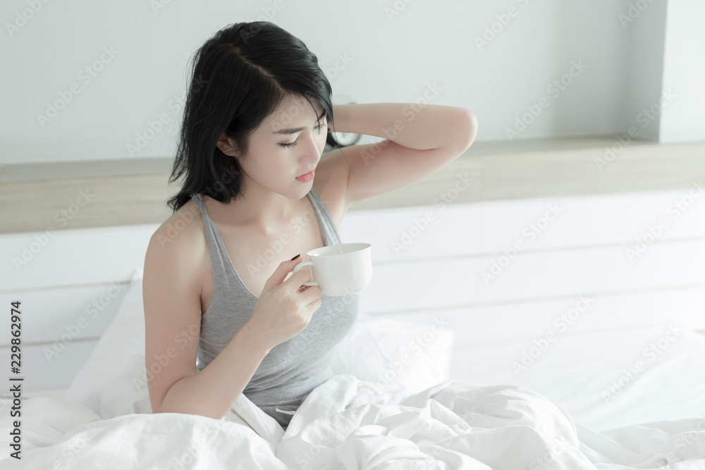 thai Young girl drinking morning coffee in bedroom thai Young girl drinking morning coffee in bedroom