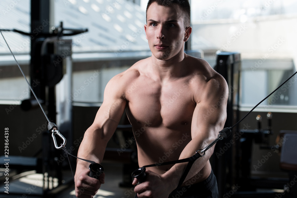 Muscular Man Exercising Chest