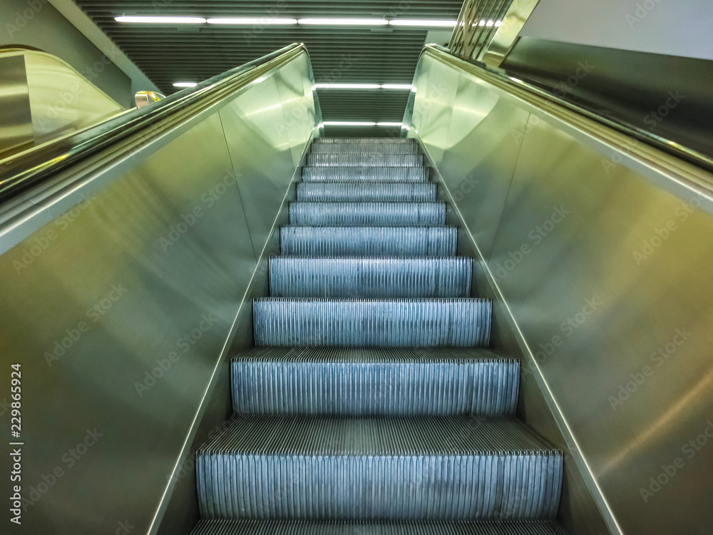 escalator in modern office center or abstract airport escalator in modern office center or abstract airport