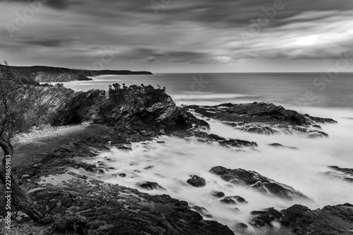 Moody black and white rocky seascape