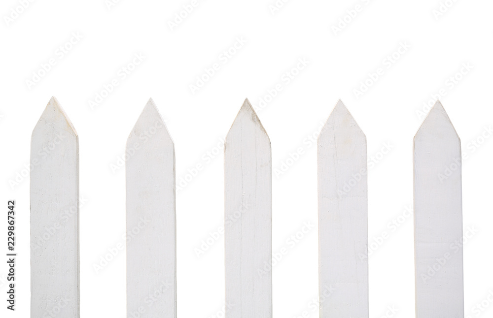 Close-up white sharp wooden fence isolated on white background. Close-up white sharp wooden fence isolated on white background.