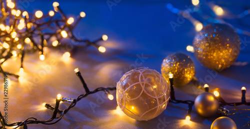 Christmas balls and lights on blue background