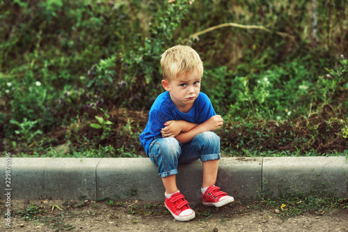 Portrait of sad little boy, upset child