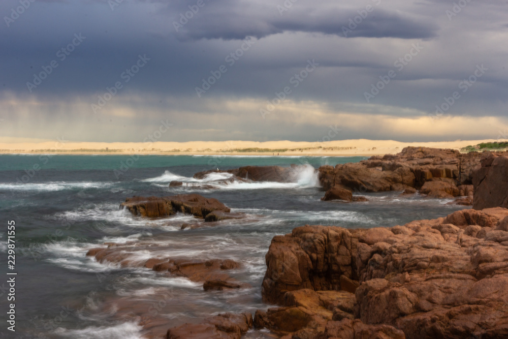 seascape Anna Bay beach in morning with sunrise sky and dramatic storm cloud seascape Anna Bay beach in morning with sunrise sky and dramatic storm cloud