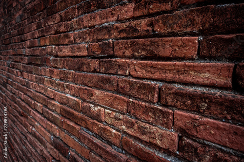 Brown brick wall texture grunge background with vignetted corners, may use to interior design