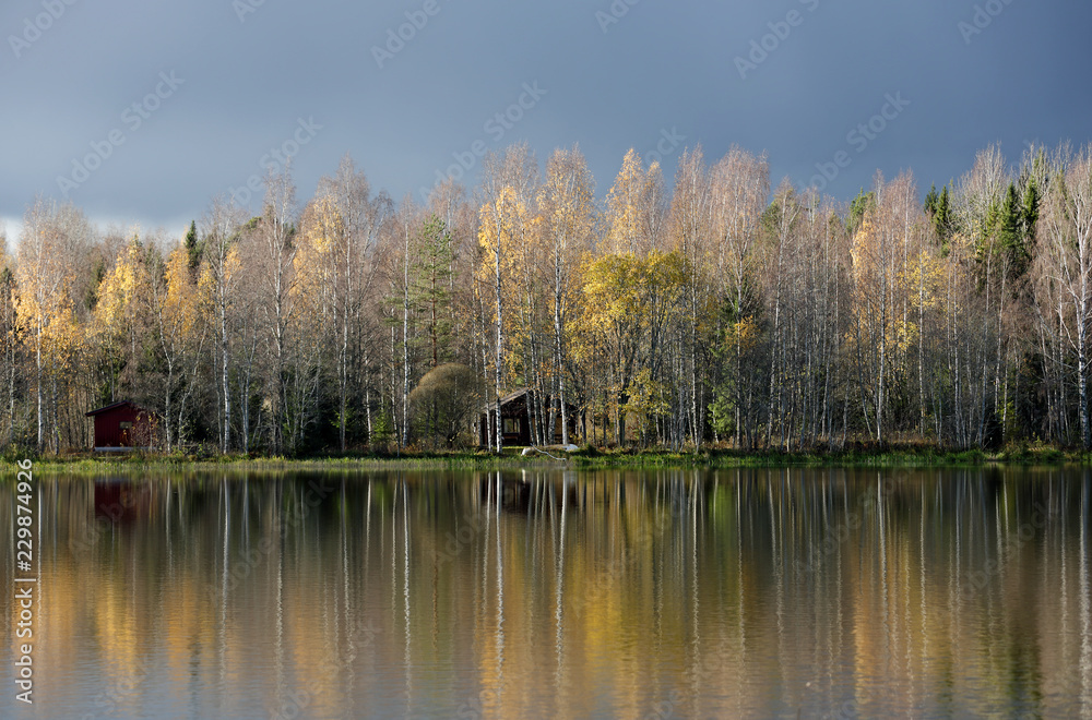 Fototapeta premium Dark clouds over the tranquil river landscape. 