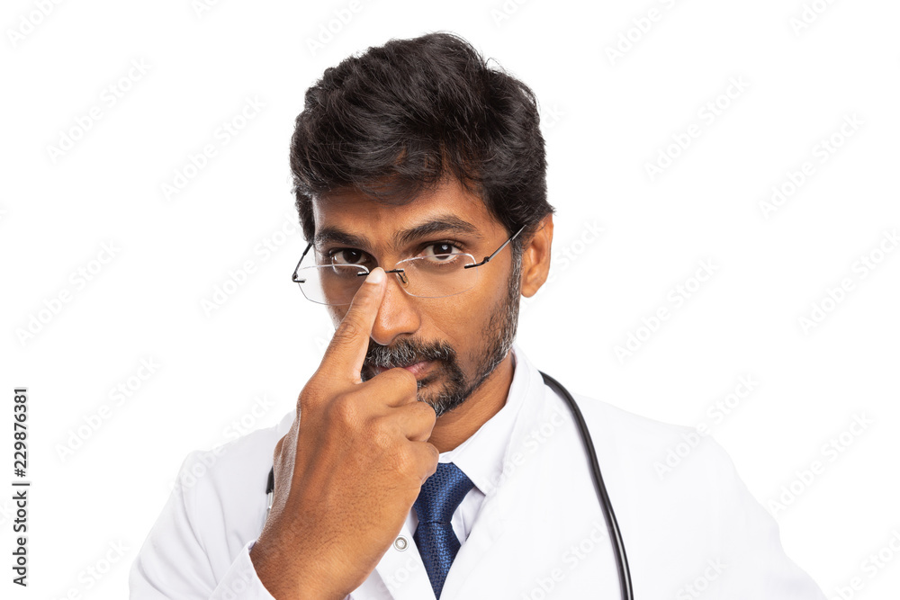 Doctor fixing spectacles with finger. Doctor fixing spectacles with finger.