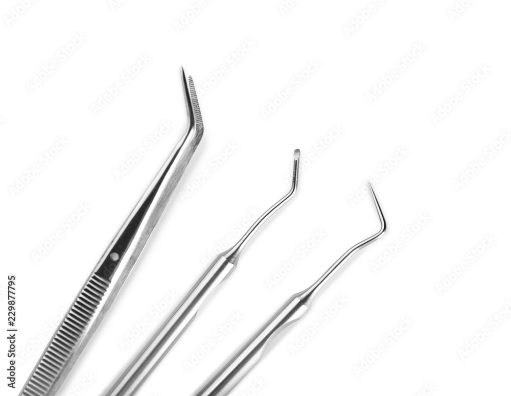 Dentist's tools on white background