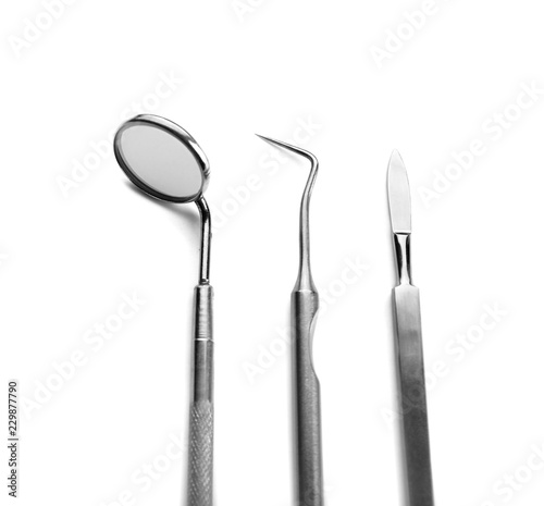 Dentist s tools on white background