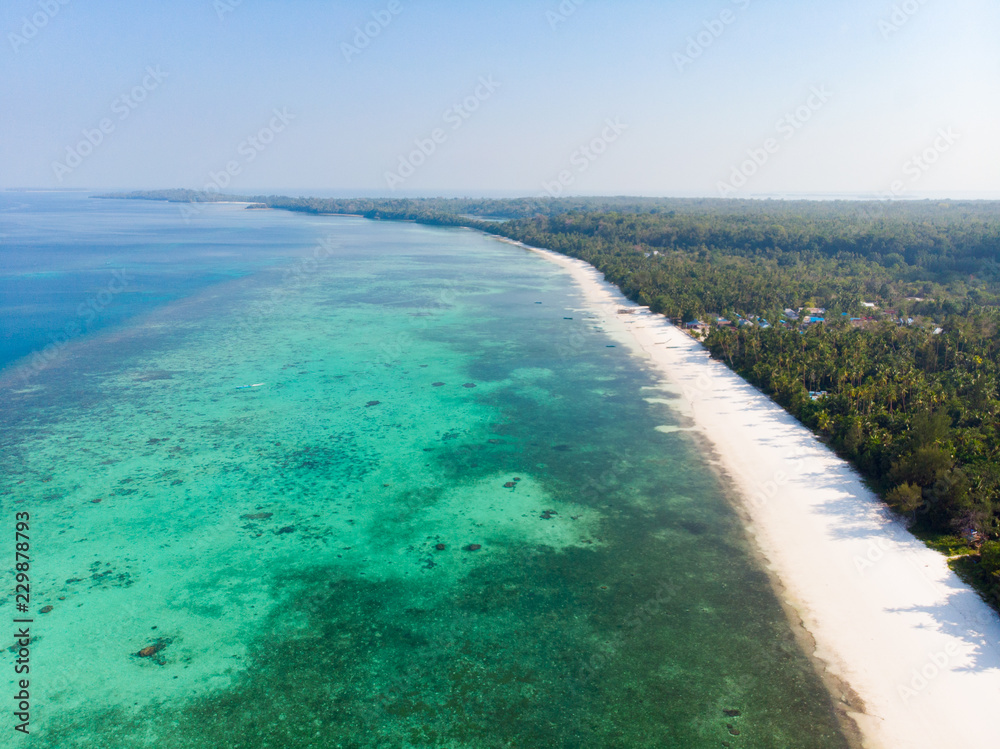 Aerial view tropical beach island reef caribbean sea at Pasir Panjang. Indonesia Moluccas archipelago, Kei Islands, Banda Sea. Top travel destination, best diving snorkeling, stunning panorama.