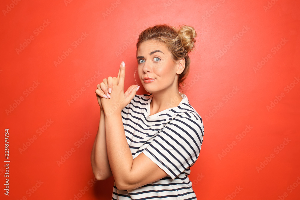 Portrait of funny young woman showing Portrait of funny young woman showing