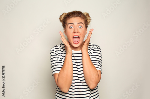 Portrait of scared young wo...