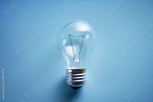 Traditional lightbulb on blue