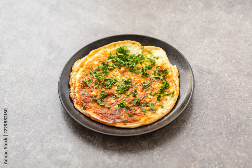 Scrambled eggs with herbs in the plate. Delicious breakfast Scrambled eggs with herbs in the plate. Delicious breakfast