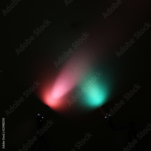 Red and green lanterns on a black background