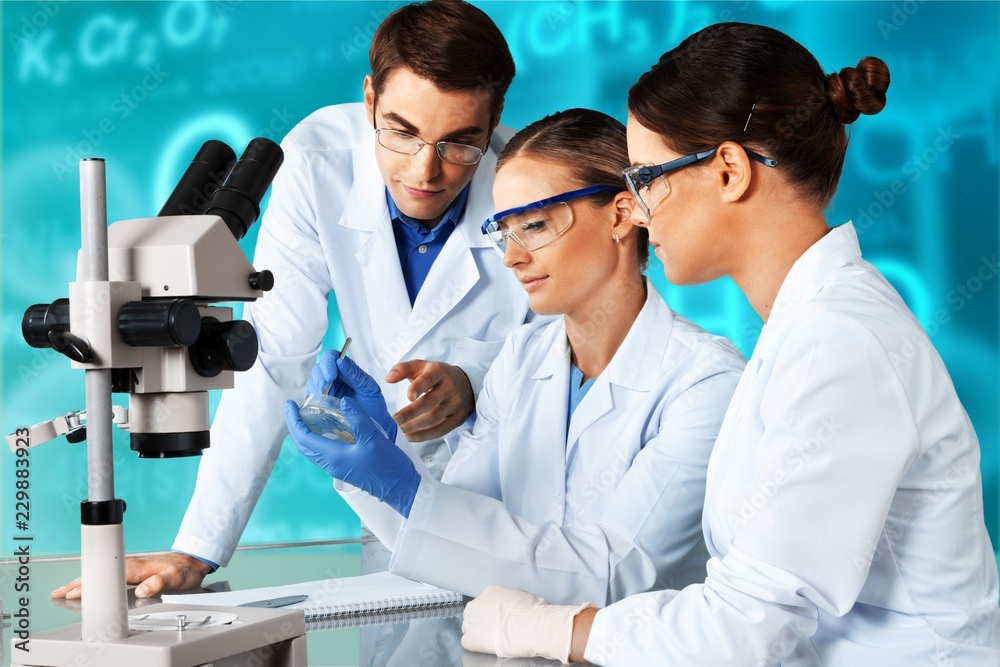 Female and male scientists in glasses working Female and male scientists in glasses working