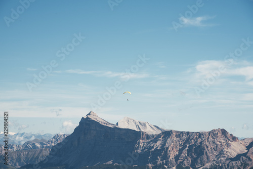 Paragliding over the peaks of the Dolomites photo