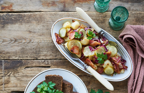 Warm salad with potatoes, bacon and pickles