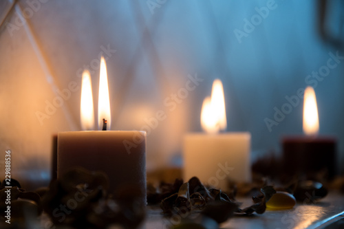 relaxing spa background with candles and some wooden petals