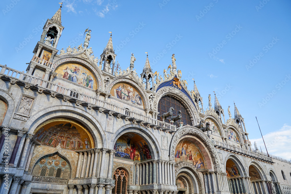 Venice, San Marco basilica facade, blue sky in Italy