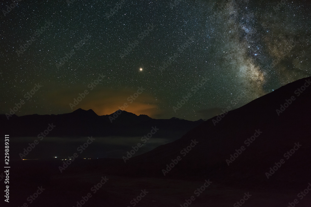 The bright stars of the Milky Way in the night sky over the mountains of the North Caucasus. The bright stars of the Milky Way in the night sky over the mountains of the North Caucasus.