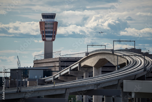 train tracks and airport control tower