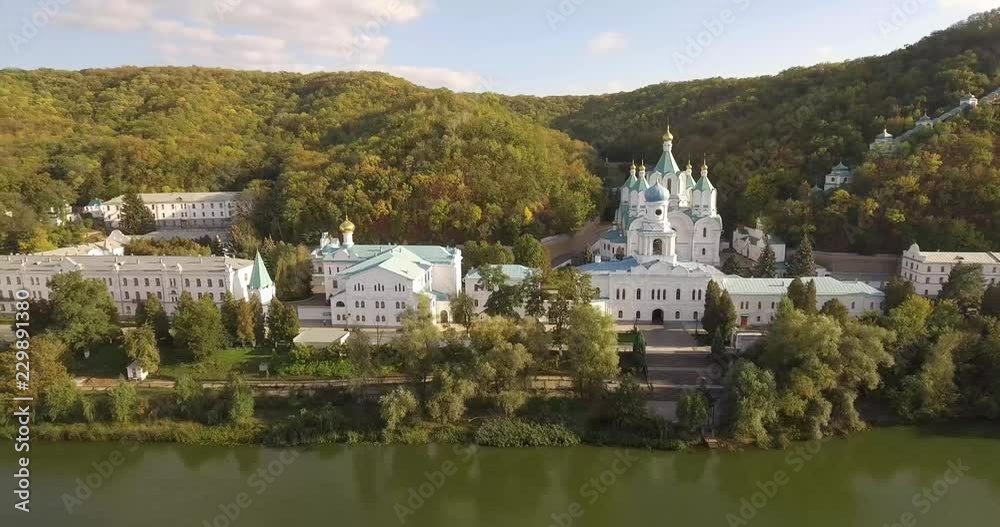 Orthodox Lavra in the forest on the slopes of the river banks. Ukraine. Svyatogorsk